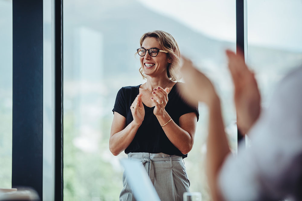 confident woman clapping